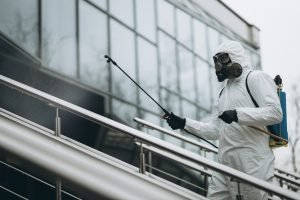 A man engaged in commercial disinfecting and sanitizing