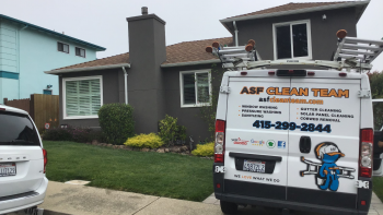 ASF Clean Team, a commercial window cleaning company, at a client's home