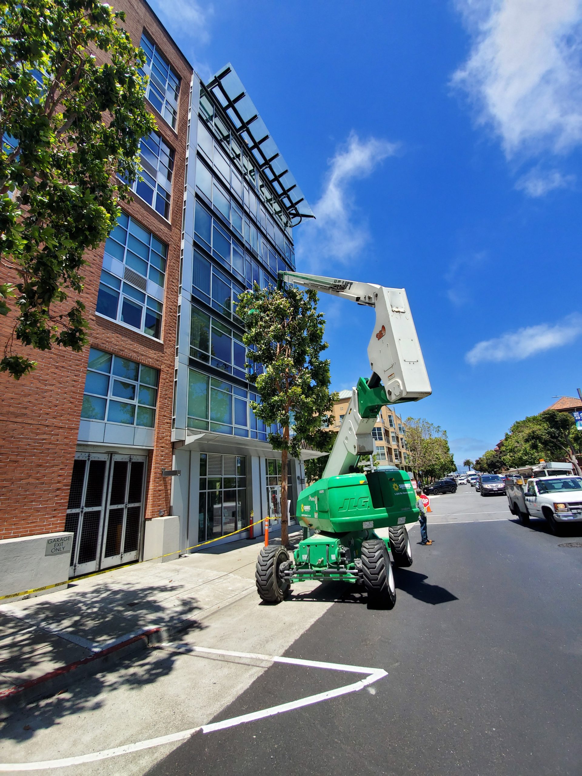 commercial exterior cleaning contractor cleans a high rise building
