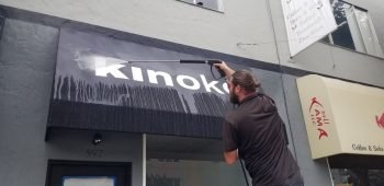 Awning being cleaned by a cleaning company.